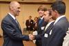 Tony Dungy, the first African American coach to lead an NFL team to Super Bowl victory, greets Luke Foshee, junior biology major, during the Roy L. White Golf and Gala.  - Photo by Beth Spain
