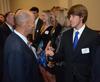 Union soccer player, Jacob Long, meets Super Bowl winning coach, Tony Dungy, who was the keynote speaker at Union's annual Roy L. White Golf and Gala. - Photo by Ebbie Davis