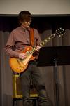Greg Thornbury, dean of the school of theology and missions, plays with the worship team during chapel. - Photo by Ebbie Davis