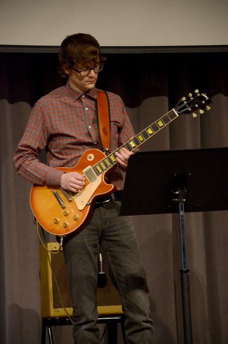 Greg Thornbury, dean of the school of theology and missions, plays with the worship team during chapel.
