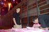 Dustin Smith (left), sales and marketing executive, waits behind the field as Brandon Bantz, Jackson Generals catcher, signs pink jerseys as part of the Union sponsored "shirt off your back" auction to support the American Cancer Society.  - Photo by Beth Spain