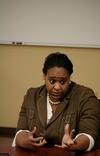 Lisa Peoples, executive director of Area Relief Ministries, speaks on a panel at the last night of the Town & Gown lecture series on the subject of Children and Community. - Photo by Deanna Santangelo