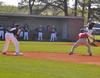 Derek Roof turns and throws to first baseman Kevin Kirksey (9) to pick off a runner. - Photo by Uncredited