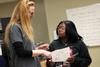 Brenda Peirson, professor of chemistry, talks with a student during a chemistry lab experiment.  - Photo by Kristi McMurry