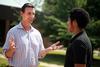 Roman Williams, assistant professor of sociology, chats with Matt Arnold, sophomore Christian studies major.  - Photo by Kristi McMurry