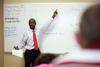 Richard Addo, associate professor of pharmacy, reviews his students for the final exam.  - Photo by Kristi McMurry