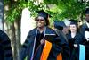 Tijuana Terrell, doctor of nursing practice graduate, walks to the Great Lawn for spring graduation.  - Photo by Deanna Santangelo