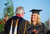 Megan Seals, journalism graduate, receives her diploma during spring graduation. - Photo by Jacob Moore