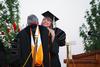Betsy Davis, senior class president, embraces David S. Dockery, president of the university, before giving her speech at spring graduation. - Photo by Jacob Moore