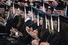 Graduates applaud during spring graduation on the Great Lawn. - Photo by Jacob Moore