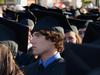 Jake Carroll, nursing graduate, waits patiently to receive his degree at spring graduation. - Photo by Victoria Stargel