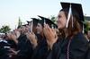 Graduates applaud during spring graduation. - Photo by Victoria Stargel