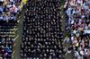 Union University's graduating class of 2011 gathers on the Great Lawn to celebrate in their accomplishments at spring graduation. - Photo by Ebbie Davis