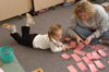 Sophomore Kristen Lutrell, learning foundations major, makes flashcards with a student at Parkview Motessori during Day of Remembrance 2003. - Photo by Jonathan Blair