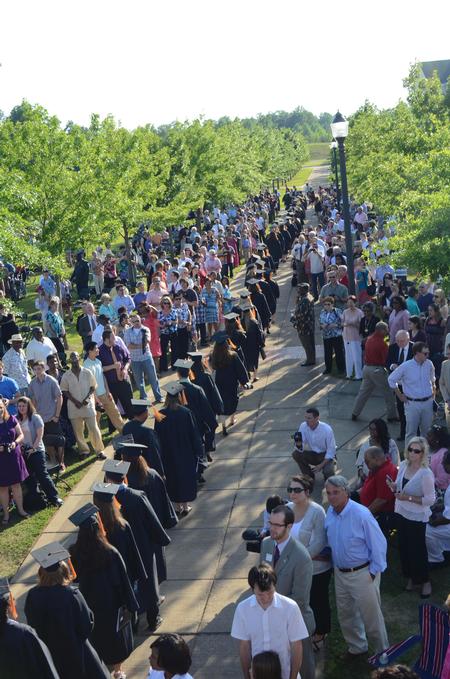 The graduates make their way to the Great Lawn for spring graduation.
