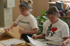 Juniors Jade Barnard and Lori Smith filed papers for a teacher at Parkview Montessori during Day of Remembrance 2003. - Photo by Jonathan Blair