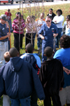 Chemistry professor Charles Baldwin and Junior Chemistry major Neil Jackson talk about the benefits of trees to students at Parkview Montessori during Day of Remembrance 2003. - Photo by Jonathan Blair
