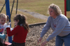 Sophomore Learning Foundations major Kristen Lutrell takes recess with some children during Day of Remembrance 2003. - Photo by Jonathan Blair