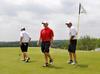 Steven Coffelt (left), Brett Barry and head coach Andy Rushing leave the No. 4 green during the NAIA National Tournament practice round at TPC Deere Run. - Photo by Steven Aldridge