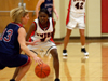 Union sophomore guard, Latorya Fuller (4) defends against a Lyon College Piper ball handler. - Photo by Jonathan Blair