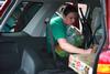 Julie Bradfield, director of student mobilization, unloads a new student's car during New Student Move-in.  - Photo by Kristi McMurry