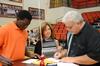 Bangali Sillah, freshman business major, along with Tim and Patty Purselley, begin registration during New Student Move-in. - Photo by Zac Calvert