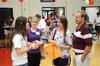 Ali Jeffries, freshman, talks with Gretchen Endres, freshman nursing major, and her family during registration for New Student Move-in. - Photo by Jacob Moore