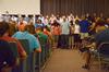 New students and their families join hands during a prayer over the new students and the beginning of their college experience in the GM Savage Memorial Chapel. - Photo by Jacob Moore