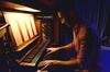 Sam Ritter, senior music major, plays the organ for a skit performed at the annual Focus Show. - Photo by Ebbie Davis