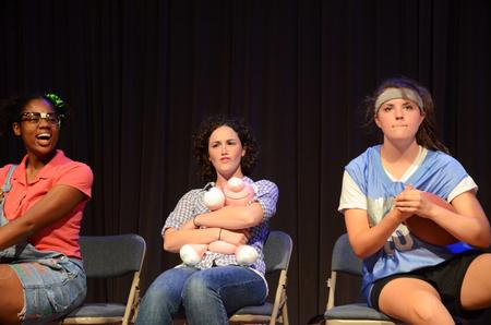 Mandisa Wofford, senior economics major, Amelia Seaton, sophmore nursing major, and Anna Marie Deschenes, junior social work major, perform a skit at the annual Focus Show. 