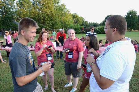 Freshmen Tim Zornes, Emma Barnett, Madi Hanks, Chamara Hamiliton-Corley and Cedric Townsend talk together during the annual ice cream social at the home of David and Lanese Dockery.