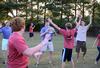 Lucas Littleton, senior biology major, looks for a teammate to pass a frisbee to during the annual ice cream social outside the home of David and Lanese Dockery. - Photo by Jacob Moore