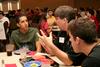 Chris Blair, associate professor of communication arts, talks with new student during Dinner with your Department in the Carl Grant Event Center. - Photo by Deanna Santangelo