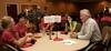 Jim Veneman, assistant professor of communication arts, talks with new students during Dinner with your Department in the Carl Grant Event Center. - Photo by Deanna Santangelo