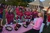 Kimberly Thornbury, vice president for student services and dean of students, serves ice cream to students at the ice cream social held at the Dockery's home. - Photo by Morris Abernathy