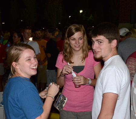 Julia Marshall, junior special education major, Sarah Welch, sophomore nursing major, and Justin Goodson, sophomore English major, talk together during the Howdy Party.