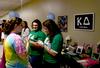 The ladies of Kappa Delta mingle with incoming freshmen at the Student Activity Fair held in the Penick Academic Center, inviting the new students to get involved with campus life.  - Photo by Ebbie Davis