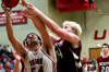 Freshman center Ben Frederick (54) grabs the rebound away from a Lyon College player.   - Photo by Jonathan Blair