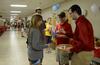 Ryan Griffin, staff assistant, hands out snacks to the incoming freshman class at the Student Activity Fair. - Photo by Ebbie Davis