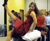 Seniors Laura Lee Moore and Nick Ellis lead an educational class on swing dancing during Swing Nite. - Photo by Jonathan Blair