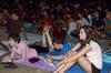 Students enjoy a movie presented in the Watters quad during Movie on the Lawn.  - Photo by Ebbie Davis