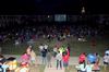 Students enjoy a movie during Movie on the Lawn while members of SAC serve popcorn, drinks, and candy.  - Photo by Ebbie Davis