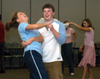 Junior Lauren Oldham and Junior Brandon Nelms practice some newly acquired moves during an educational class on swing dancing at Swing Nite. - Photo by Jonathan Blair