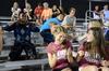 Ruth Bone, freshman biology/pre-med major, laughs at Denis Bisangwa, freshman business administration, as he dances during half time at a match between Union University's men's soccer team and Notre Dame College.  - Photo by Zac Calvert