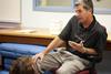 Andy Rushing, assistant professor of physical education, gives instructions to students learning mouth-to-mouth resuscitation.  - Photo by Kristi McMurry