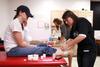 Students practice taping in a PEWS class. - Photo by Kristi McMurry