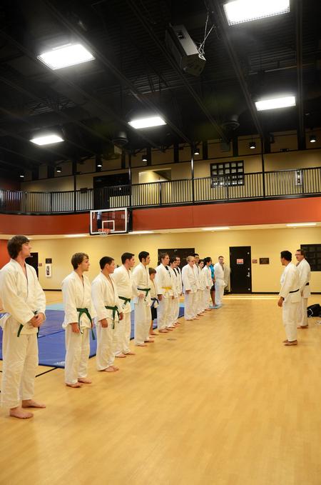 The Union Judo Club officially lines up by rank while judo master Patrick Parker and judo instructor Mario Melendez lead and train. 