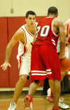 Junior forward Bruno Martinessi (32) gets in position to stop his man on defense.   - Photo by Courtney Ross