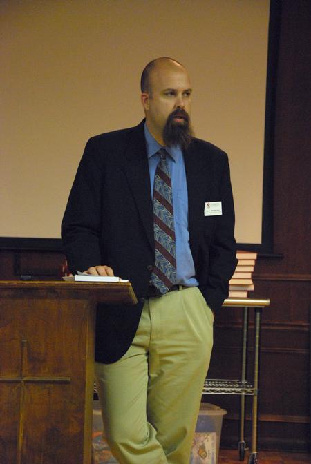 Micah Watson, director of the center of politics and religion, introduces the speaker, Matthew Anderson. 