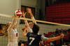 Emmie Moroski and Anna Sims defend the net against an opposing Lyon player. The Lady Bulldogs won the match 3-0. - Photo by Anne Richoux